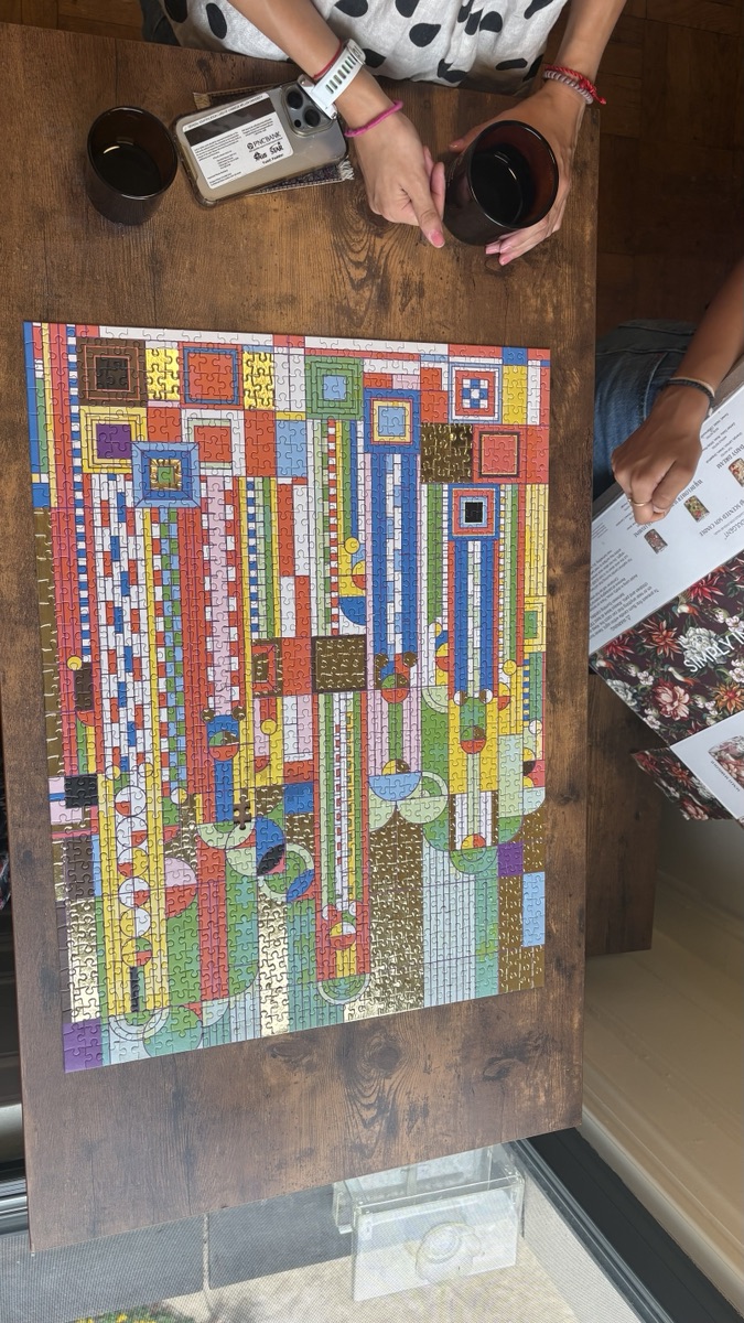 A colorful jigsaw puzzle in progress on a table